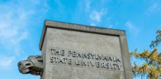 "The Pennsylvania State University stone pillar with lion sculpture."