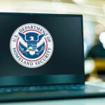 Laptop displaying U.S. Department of Homeland Security logo.