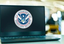 Laptop displaying U.S. Department of Homeland Security logo.