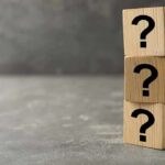 Mystery Surrounds Deaths Of USS George Washington Sailors Three wooden blocks with question marks stacked.