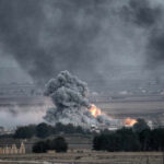Explosion Shakes Vietnamese Military During Exercise In Dong Nai Province Explosion with smoke and fire in open landscape.