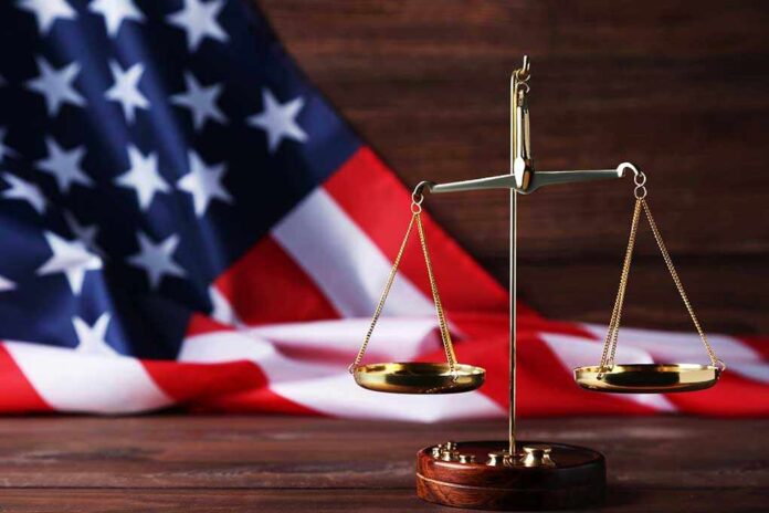 1079617001 featured image Scales of justice and American flag background.