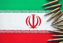 Iranian flag with bullets surrounding it.