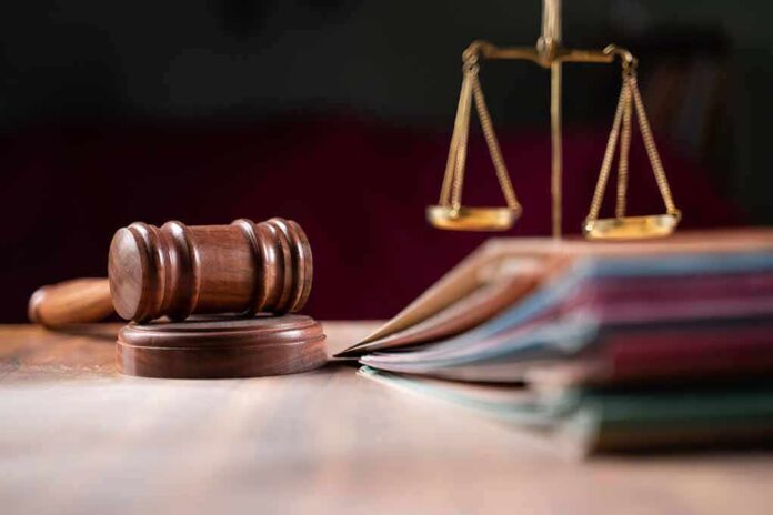 2012352206 featured image Judges gavel, scales of justice, and legal documents.