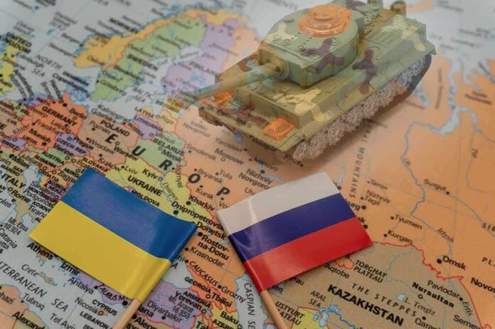 2114384846 featured image Toy tank on map with Ukraine and Russia flags