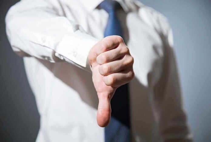 314376254 featured image Person giving a thumbs down gesture.