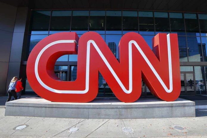 1568712067 featured image Large red CNN sign outside building entrance.