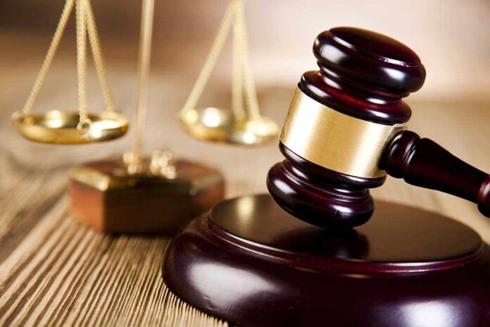 184689941 featured image Gavel and scales of justice on wooden surface.