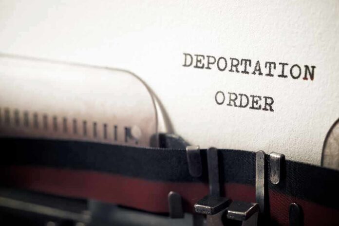 1931733599 featured image Typewriter typing deportation order paper document