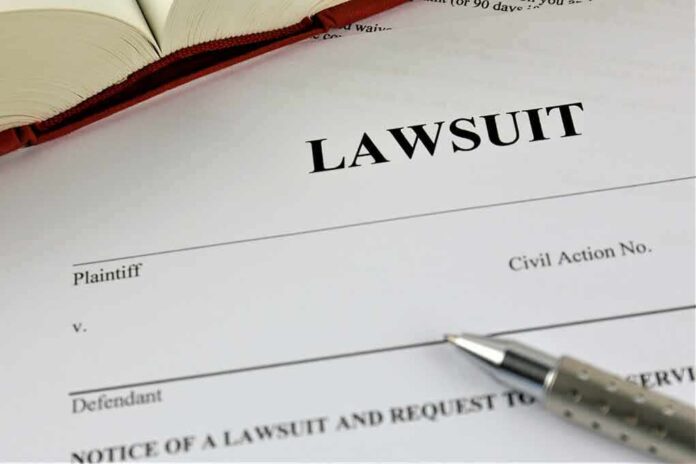 775826128 featured image Lawsuit document with a pen and book.