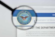 Magnifying glass over Department of Defense logo
