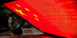 Laptop screen displaying Chinese flag and code