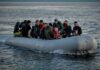 People on a packed raft in open water