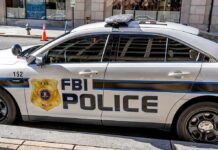 FBI police car parked on city street