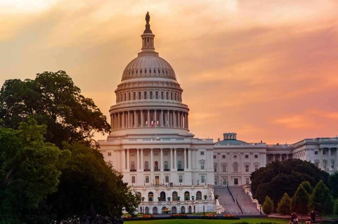 1863956683 featured image United States Capitol building at sunset with trees