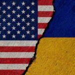 Torn United States and Ukraine flags