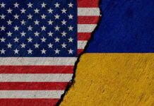 Torn United States and Ukraine flags