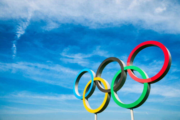 1418515019 featured image Olympic rings against a bright blue sky backdrop