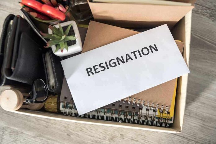 1487893499 featured image Envelope labeled resignation in a box of office items