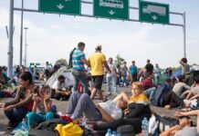 People sitting and resting on a highway
