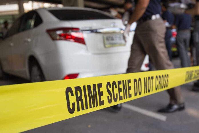 351048443 featured image Crime scene tape blocking off white patrol car