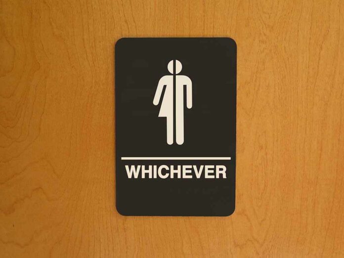 Bathroom sign reading whichever on door