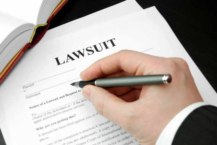 93505333 featured image Filling out lawsuit form with pen