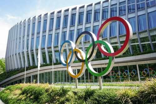 International Olympic Committee IOC_2163962535.jpg featured image Building with Olympic rings and flags outside