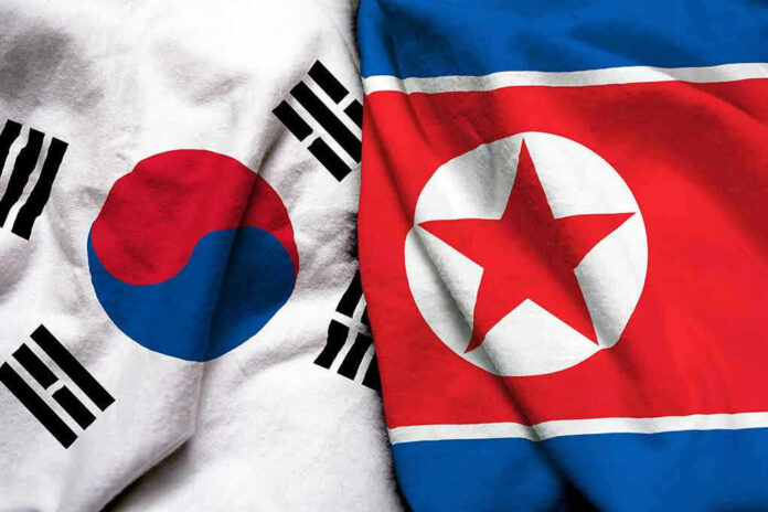 1059722948 South Korean and North Korean flags side by side