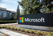 Microsoft sign with office buildings and trees