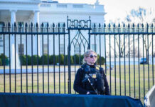 Secret Service agent stands guard outside the White House