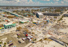 Aerial view of hurricane-damaged buildings and debris