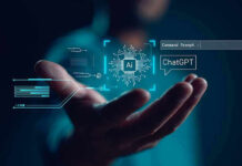 Hand holding digital AI and ChatGPT graphics