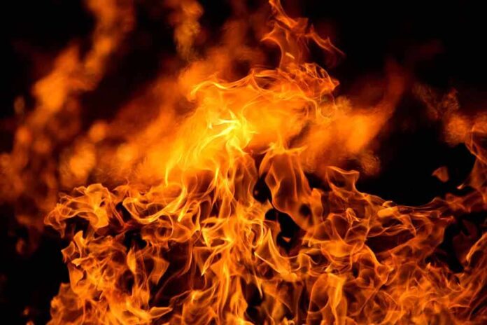 Close up of vibrant flames against a dark background