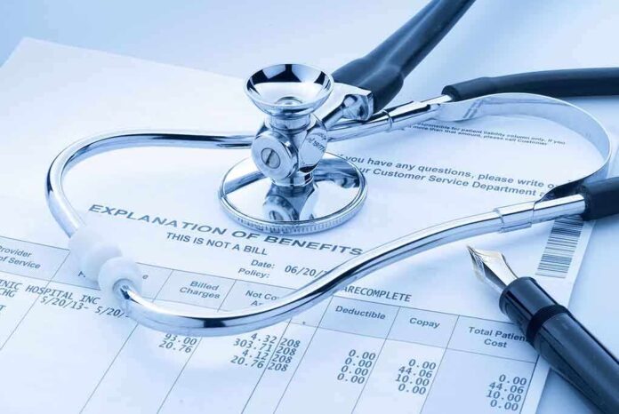 A stethoscope resting on a medical billing statement