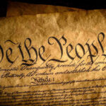 Constitutional Chaos: Trump wants 147-Year Rule GONE! Close-up of the U.S. Constitutions preamble.