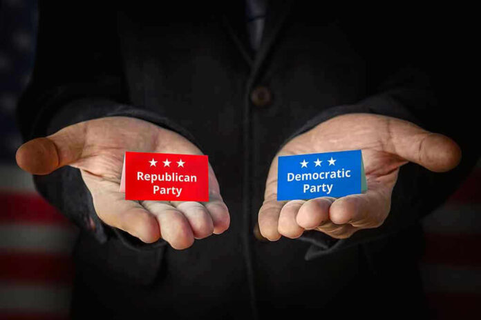 2191944745 Hands holding Republican and Democratic Party cards.