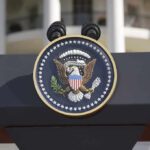 Trump Delivers Maduro DIRECT THREAT – Stark Ultimatum! Close-up of the presidential seal on a podium