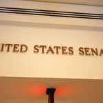 Sign displaying United States Senate in a government building