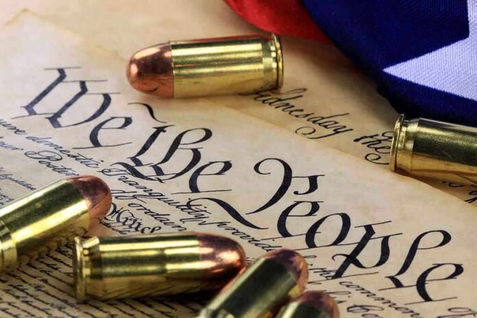 Close-up of bullets surrounding a historical document with the phrase We the People