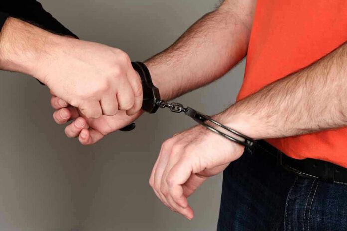 Person handcuffing another persons wrists