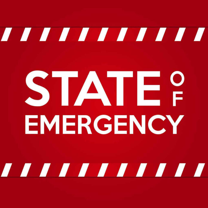 STATE OF EMERGENCY in bold white text on red background.