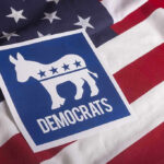 Democrats symbol on American flag background.