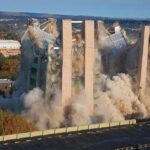 Blast Rocks NYC—Building COLLAPSES! A building being demolished with dust and debris in the air
