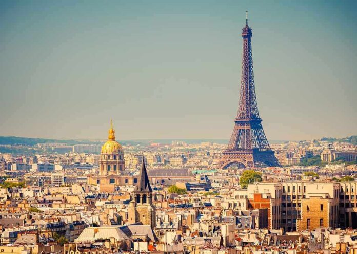 A panoramic view of Paris featuring the Eiffel Tower and a golden dome