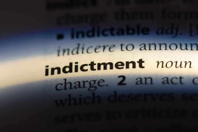 Close-up of a dictionary page showing the word 'indictment' and its definition