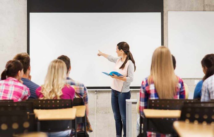 A teacher presenting to students in a classroom