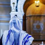 Armed Terrorist THWARTED – Seven Minutes Before Explosion! A person wearing a tallit in a synagogue during prayer