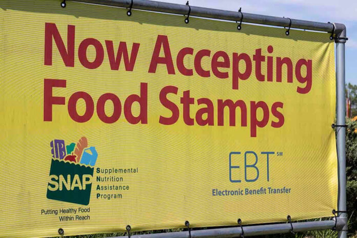 Yellow sign now accepting food stamps EBT SNAP