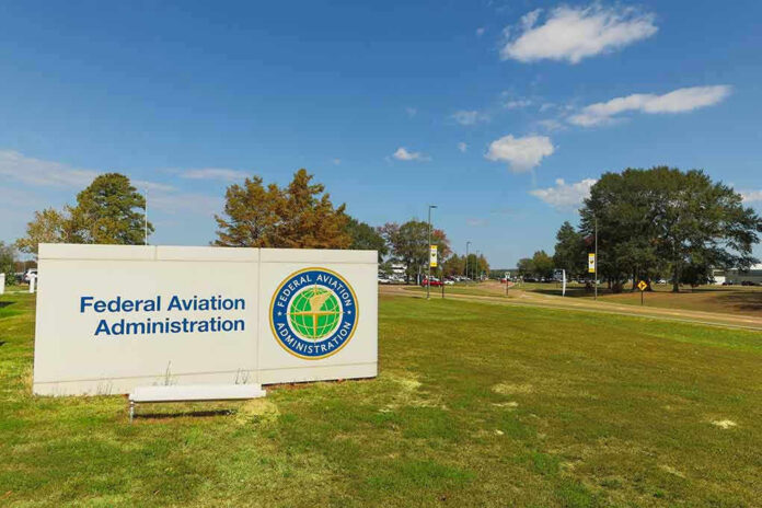 Federal Aviation Administration sign on grassy lawn.